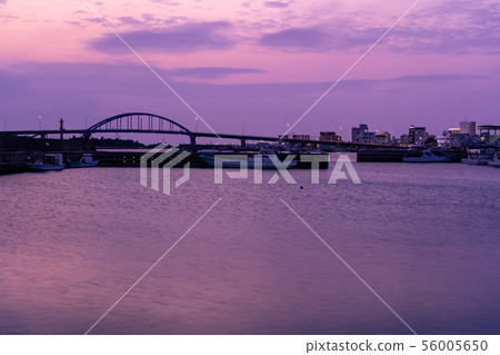 Sunset view of the southern gate bridge seen from Okinawa Ishigakijima Tonojo fishing port 56005650