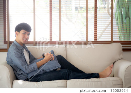Portrait young handsome asian man napping relax 56008924