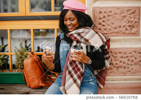Elegant black girl in a winter city 56010708