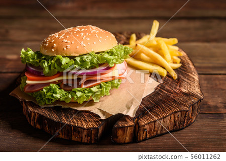 Tasty grilled homemade burger with beef 56011262