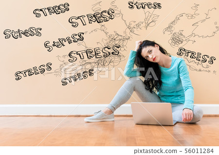 Stress theme with woman using a laptop 56011284