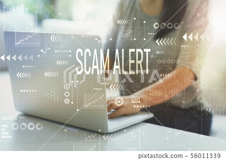 Scam alert with woman using laptop Scam alert with woman using laptop 56011339