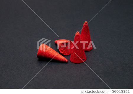 Close up Group of Red Incense on iSolated Black 56015561