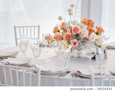 Table served for wedding banquet with roses 56016843