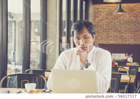 Handsome businessman working thinking about 56017317
