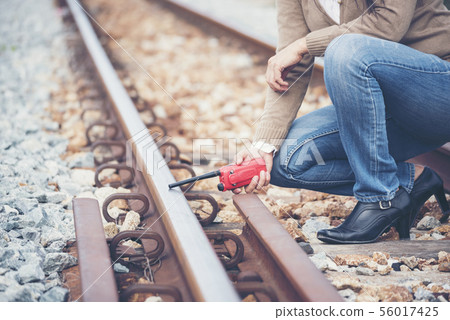 Civil Engineer Team holding blueprint plan for Civil Engineer Team holding blueprint plan for 56017425