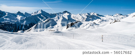 Sunny winter day in alpine ski resort 56017682