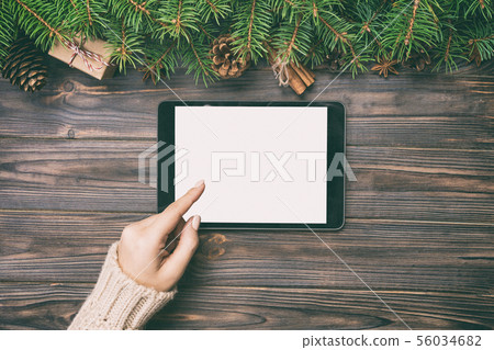 Christmas online shopping. Female hand touch 56034682