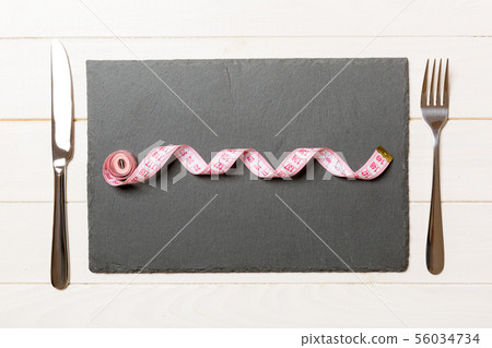 Healthy diet concept of plate with measuring tape, 56034734