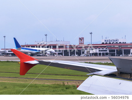 Airplane wing and Nagasaki Airport Airplane wing and Nagasaki Airport 56034976