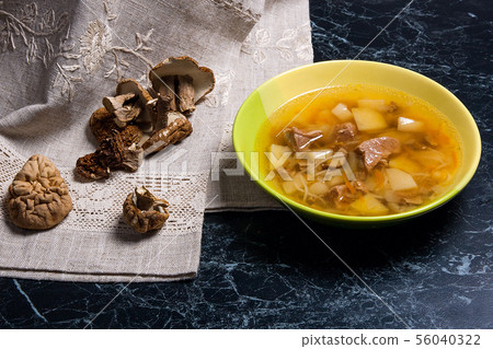Composition with mushroom soup in green plate, Composition with mushroom soup in green plate, 56040322