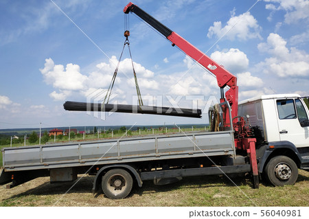 The truck crane in the field on the private land The truck crane in the field on the private land 56040981