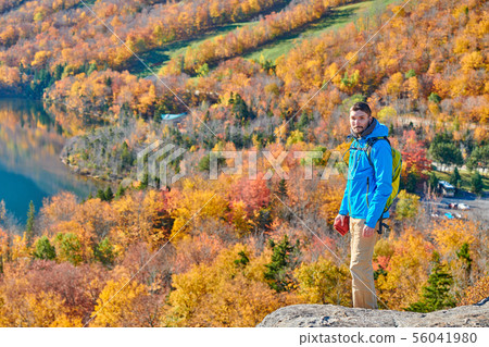 Backpacker man at Artist's Bluff in autumn Backpacker man at Artist's Bluff in autumn 56041980