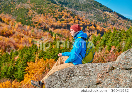 Backpacker man at Artist's Bluff in autumn Backpacker man at Artist's Bluff in autumn 56041982