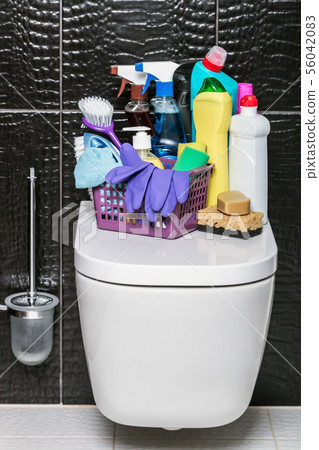 different products and items for cleaning on the floor in the toilet room 56042083