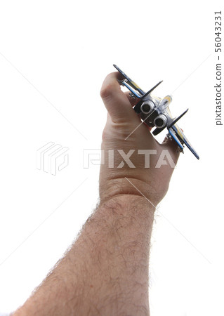 air fighter toy in human hand 56043231