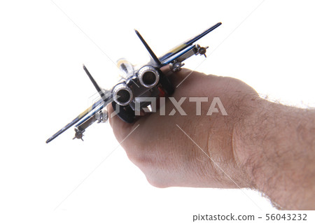 air fighter toy in human hand 56043232