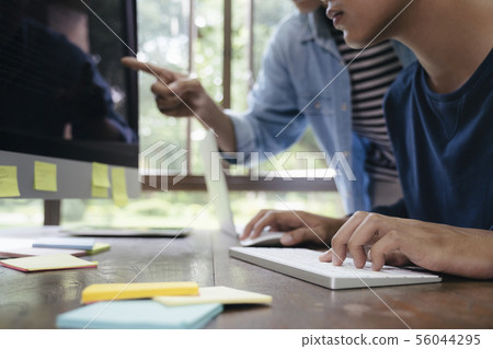 Programmers and developer teams are coding and Programmers and developer teams are coding and 56044295