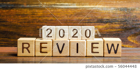 Wooden blocks with the word Review 2020. Wooden blocks with the word Review 2020. 56044448