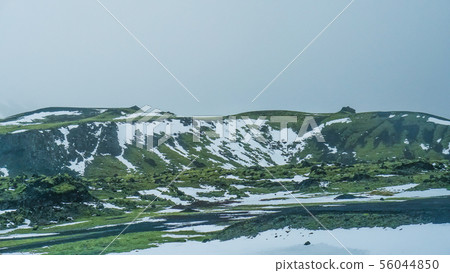 Iceland bad weather snow and fog mountaitn 56044850