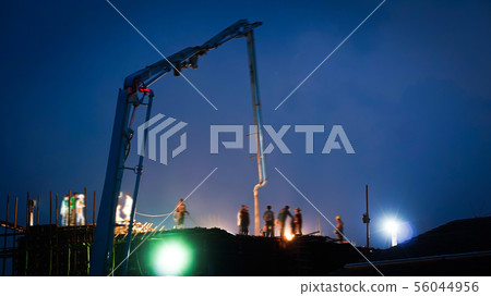 Construction crane truck working on structure at Construction crane truck working on structure at 56044956