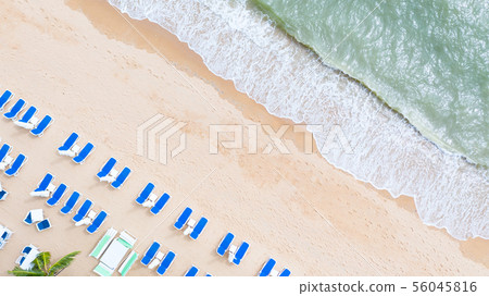 Aerial top view on the sandy beach. Umbrellas, 56045816
