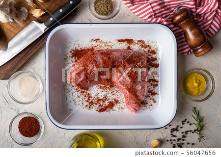 rubbing santa maria style sauce on tri-tip steak rubbing santa maria style sauce on tri-tip steak 56047656