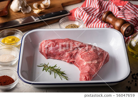 rubbing santa maria style sauce on tri-tip steak rubbing santa maria style sauce on tri-tip steak 56047659