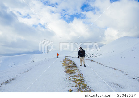 People climbing in Carpathian mountains in winter, People climbing in Carpathian mountains in winter, 56048537