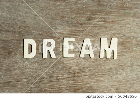 Alphabet letter in word dream on wood background Alphabet letter in word dream on wood background 56048650