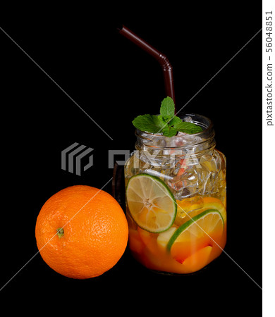 Fresh water with fruit isolated on black Fresh water with fruit isolated on black 56048851