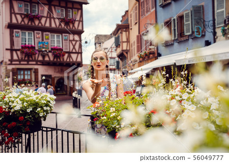 Woman tourist visiting the town of Colmar, Alsace, France 56049777