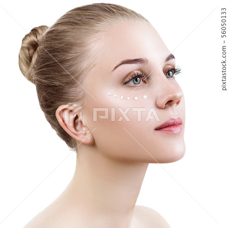 Sensual woman with cream dots on face. Sensual woman with cream dots on face. 56050133