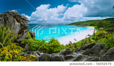 Picturesque panoramic shot of Grand Anse, La Digue island, Seychelles. Huge granite rock formation Picturesque panoramic shot of Grand Anse, La Digue island, Seychelles. Huge granite rock formation 56050479