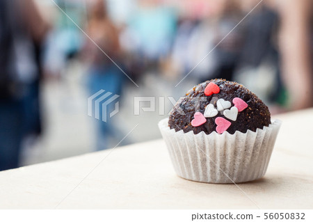 Chocolate candy with mini hearts. Chocolate candy with mini hearts. 56050832