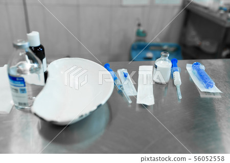 syringe kit on metal table in clinic syringe kit on metal table in clinic 56052558