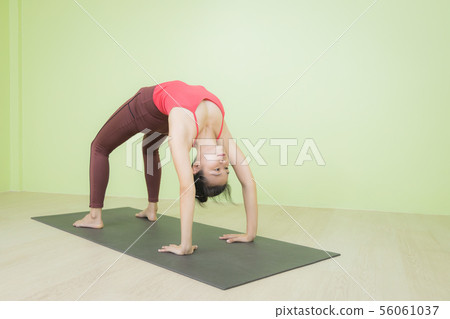 Upward facing bow yoga pose. 56061037