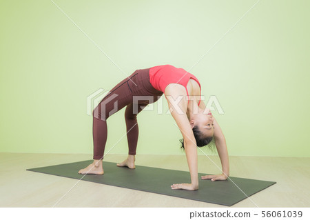 Upward facing bow yoga pose. Upward facing bow yoga pose. 56061039