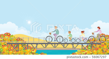 Family are riding on bicycles on bridge in autumn. 56067297