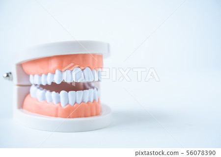 close up dentist  tools for teeth care at white 56078390