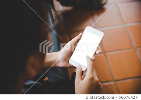 Mockup image of hand holding mobile phone blank Mockup image of hand holding mobile phone blank 56078427