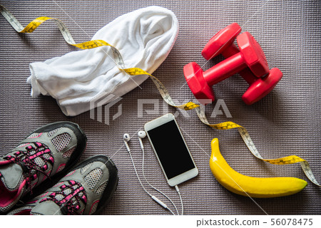 fitness concept with Exercise Equipment on wooden fitness concept with Exercise Equipment on wooden 56078475