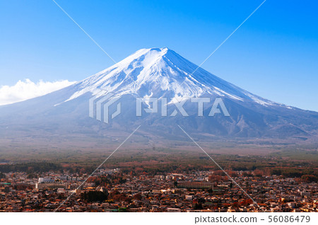 Snow covered Mount Fuji and blue sky autumn view Snow covered Mount Fuji and blue sky autumn view 56086479