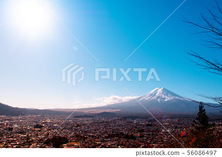 Snow covered Mount Fuji and blue sky autumn view Snow covered Mount Fuji and blue sky autumn view 56086497