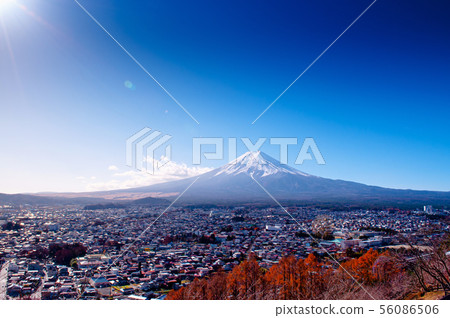 Snow covered Mount Fuji and blue sky autumn view Snow covered Mount Fuji and blue sky autumn view 56086506