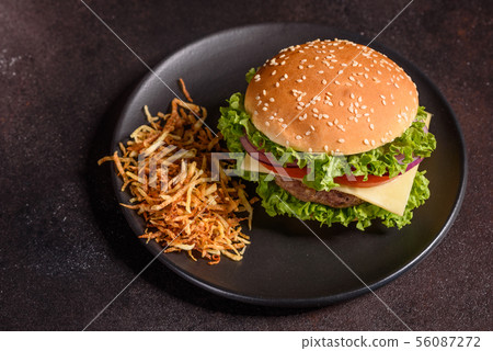Tasty grilled homemade burger with beef 56087272