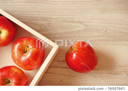 Apple in a wooden box, apple on the table 56087665