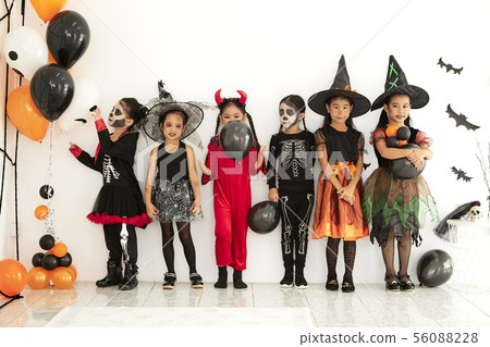 halloween party little children at home 56088228