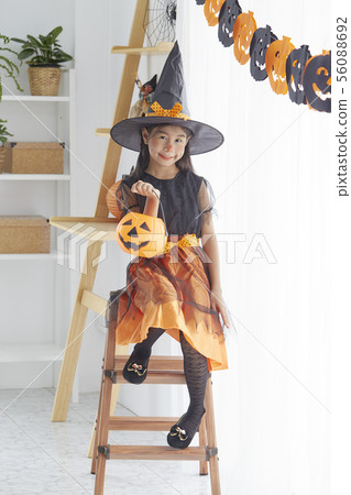 Happy child girl in witch costume to halloween Happy child girl in witch costume to halloween 56088692