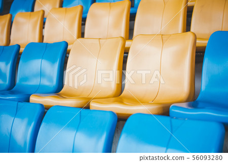 Rows of plastic seats on a grandstand, chair in a 56093280